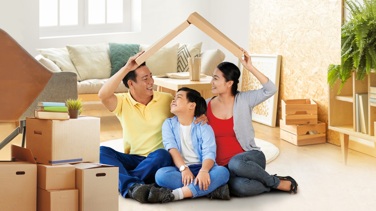 Son and parents sitting in a new house; image used for HSBC Vietnam Home Mortgage Loan page